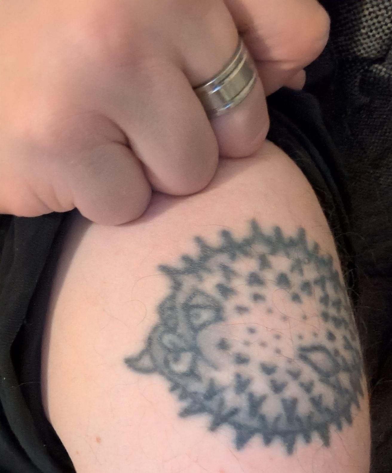 Puffy, the OpenBSD mascot, tattoo'ed on an arm