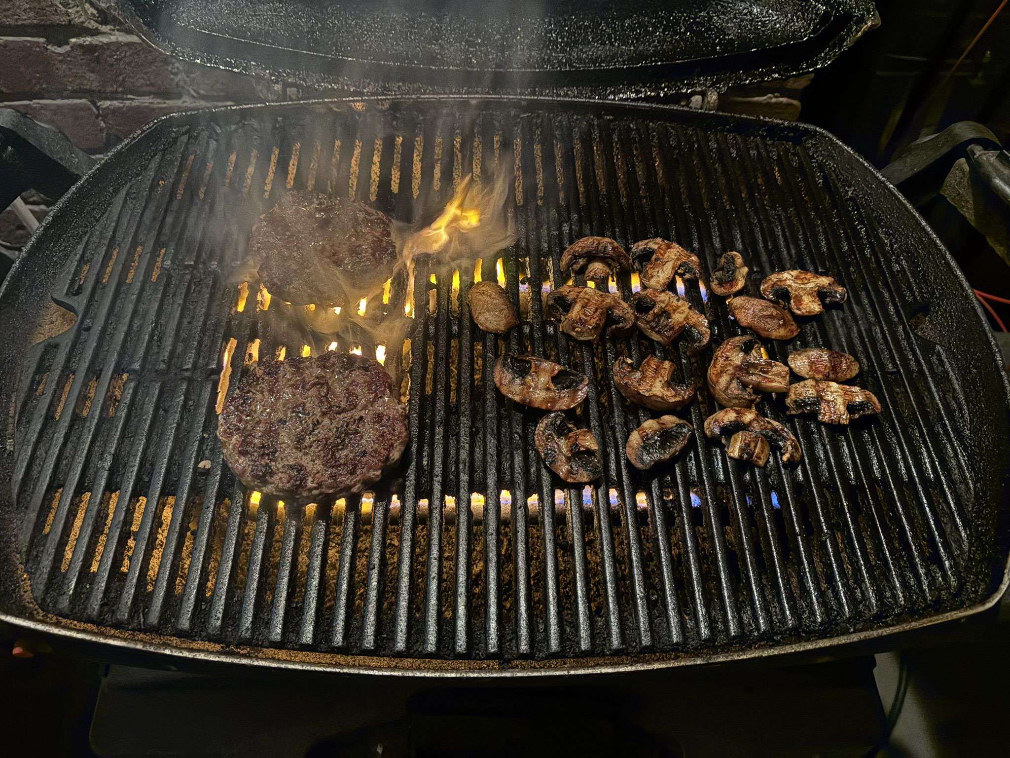 Grilling hamburgers and mushrooms